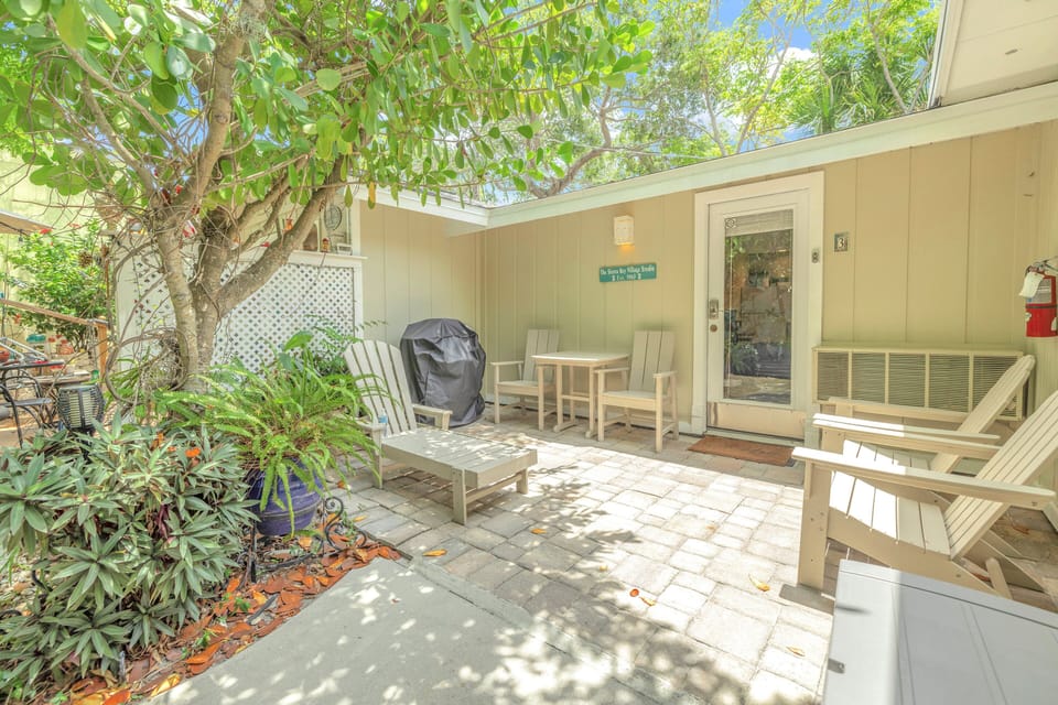 Private patio with outdoor seating, perfect for enjoying sunshine.