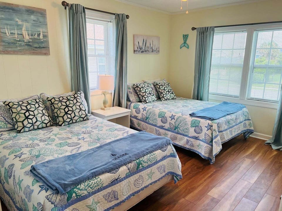 Streetside West Bedroom with Two Double Beds