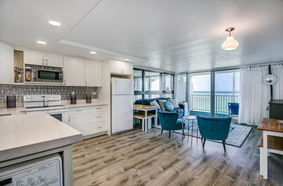 Large living room and kitchen. Living room has a queen sofa bed and a queen Murphy bed. Choose the Murphy bed for maximum comfort. 