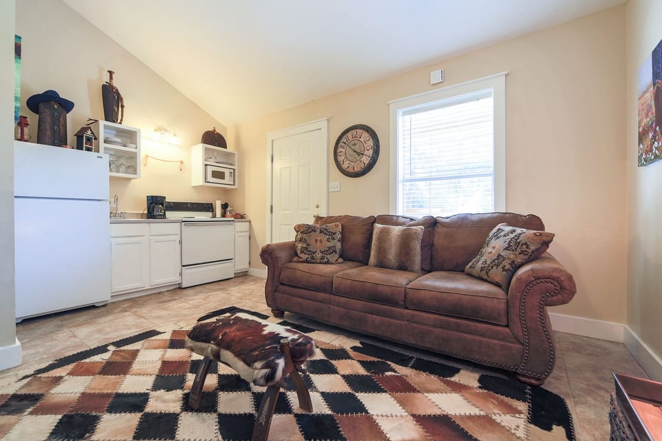 Suite 5- Authentic Cowhide Rug and Camel Saddle doubling as a Foot Stool. 