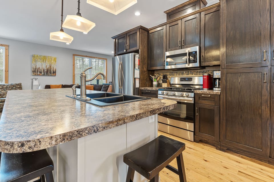 Expansive Kitchen - Open concept home with the kitchen right in the middle.  It is where everyone gathers to enjoy time together.