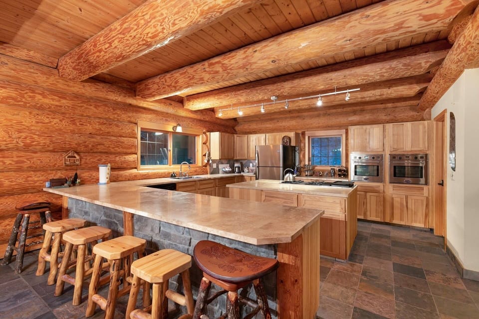 Spacious kitchen with ovens and marble countertops. Perfect for entertaining! 