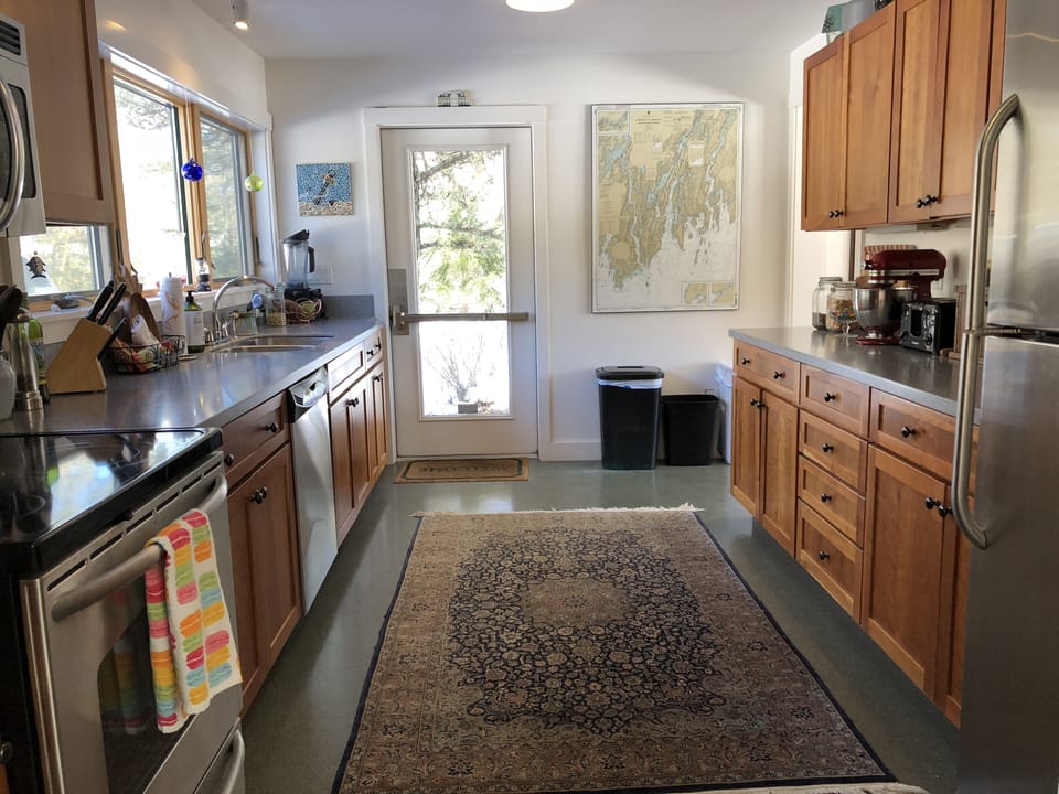 The galley kitchen is fully outfitted and has a full refrigerator also
