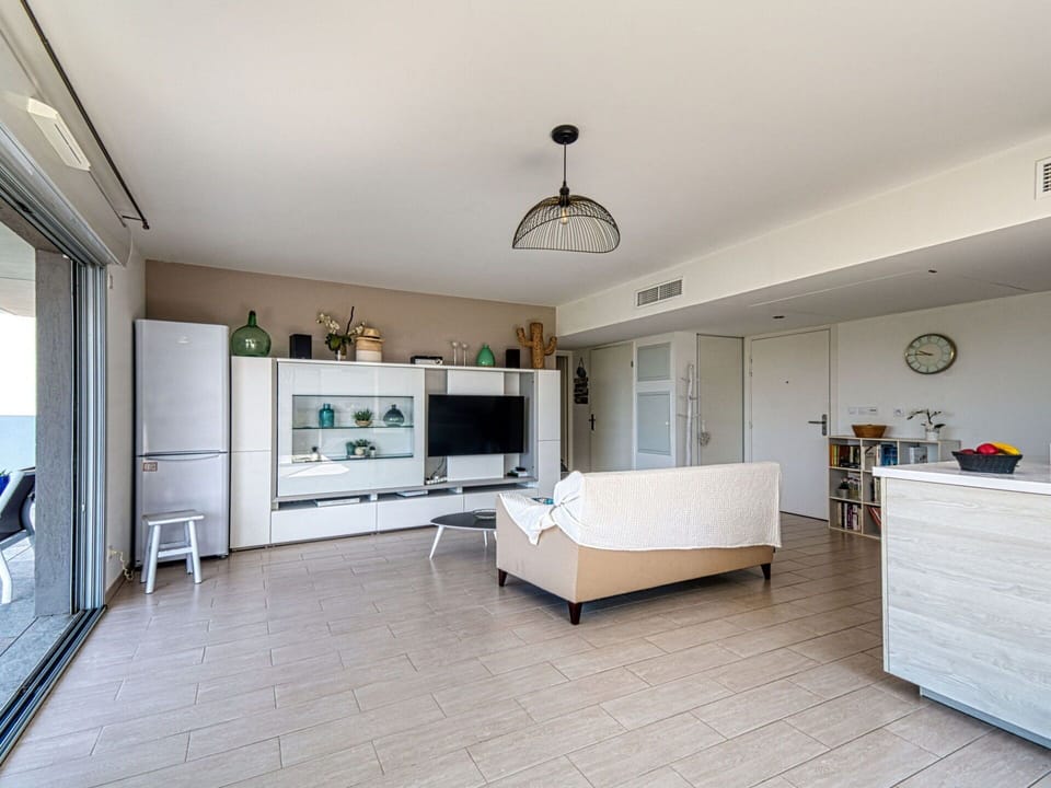 Cabinetry, Property, Furniture, Countertop, Kitchen, Television, Couch, Lighting, Houseplant, Home Appliance