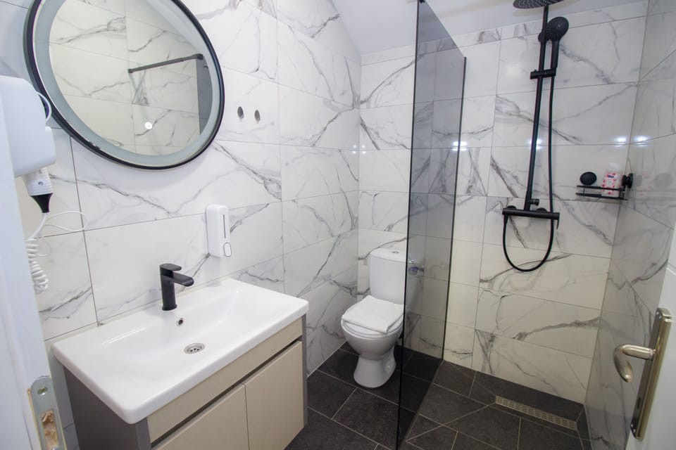 Shower, free toiletries, hair dryer, slippers