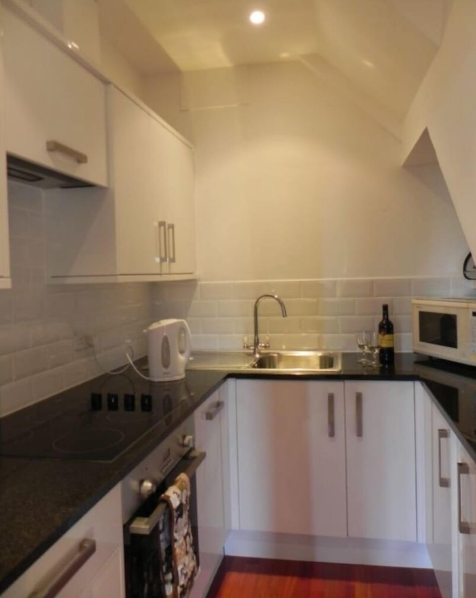 The kitchen is well- equipped with dishwasher, microwave, oven, grill and hob