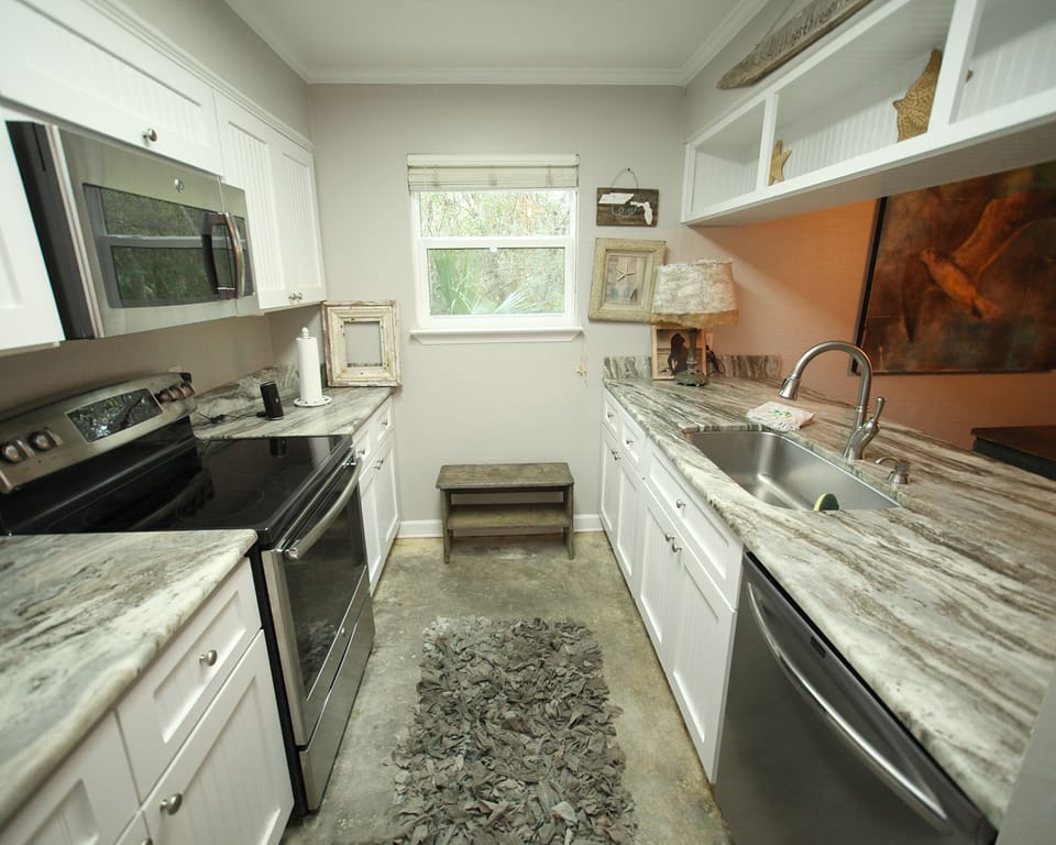 Great Galley Kitchen, love looking out onto the family room!! 