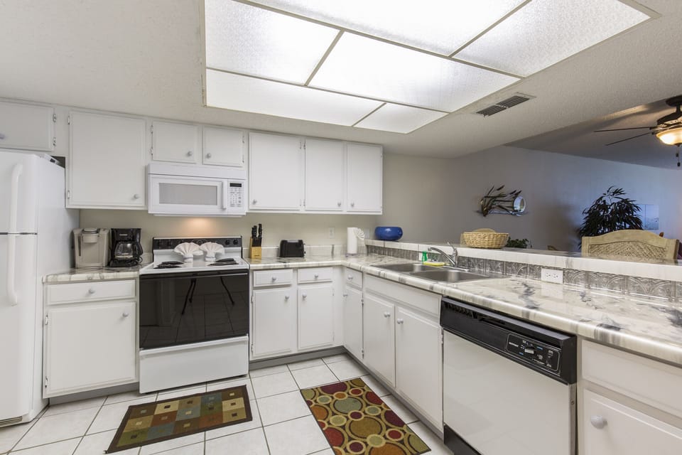 Spacious kitchen stocked with cooking utensils