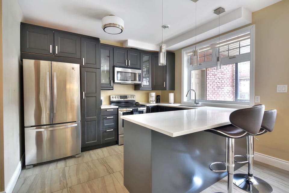 Fully equipped kitchen with dishwasher, fridge stove oven mircowave