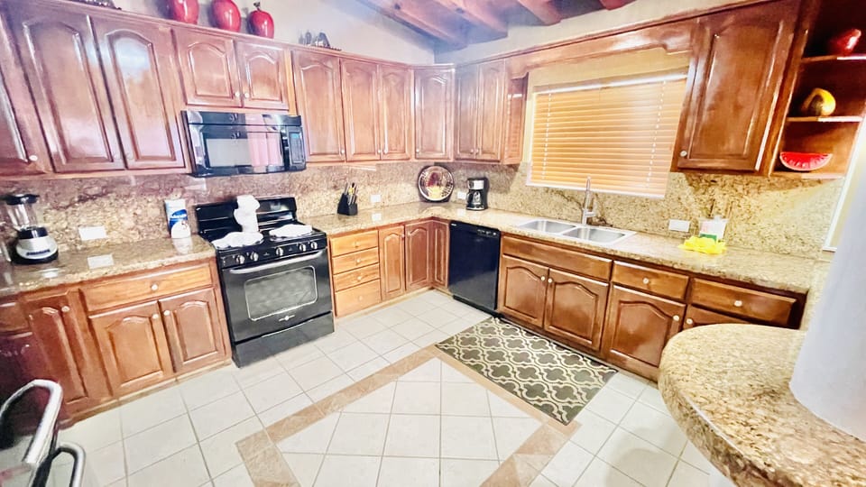 Updated cabinets along with all kitchen utensiles to cook or BBQ without going out to dine.  BBQ outside is locaed  to the left side of Villa when walking outside back patio heading to beach.
