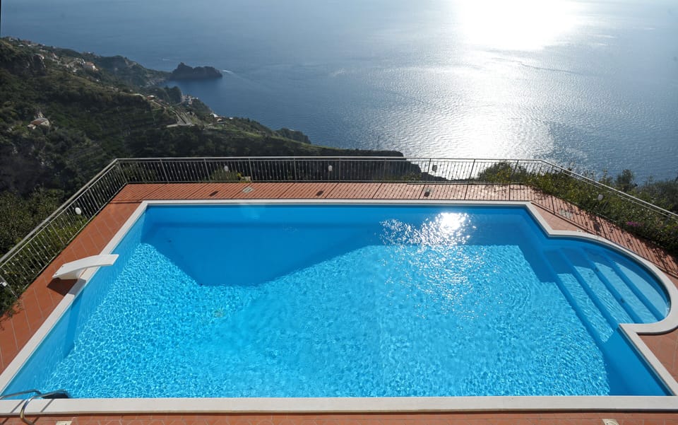 The wonderful pool with open views of coast and sea