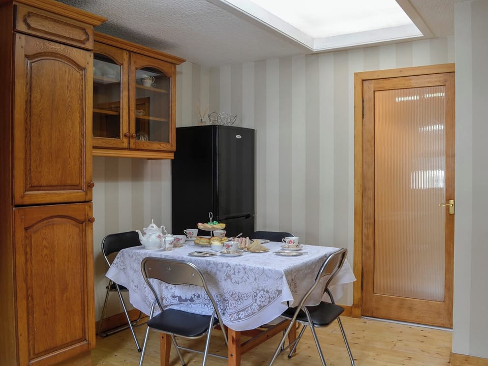 Wooden-floored kitchen/diner | Creel Cottage, Auchmithie, near Arbroath