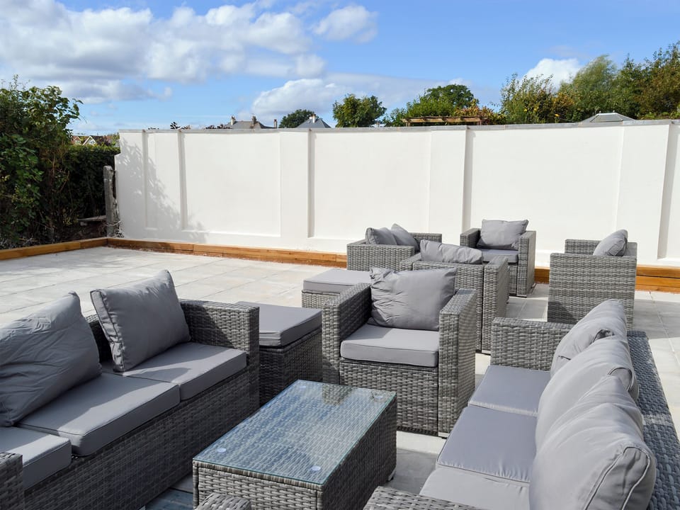 Large enclosed garden with decking, patio and garden furniture | Estuary View, Exmouth