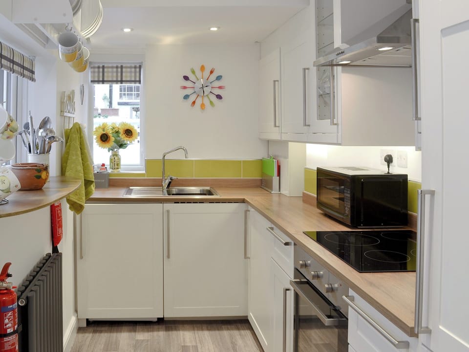 Beautiful dining room through to the kitchen | Lobster Pot Cottage, Scarborough