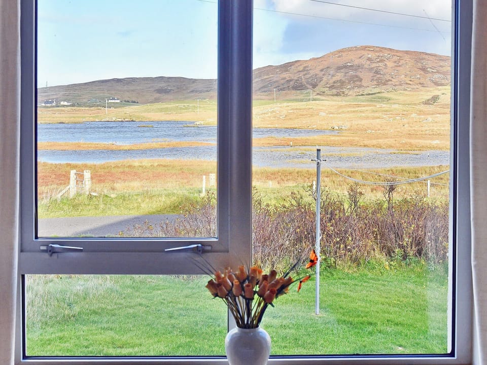 Wonderful loch views from the back bedroom | Padraig&rsquo;s Cottage, Howbeg (Tobha Beag), Isle of South Uist