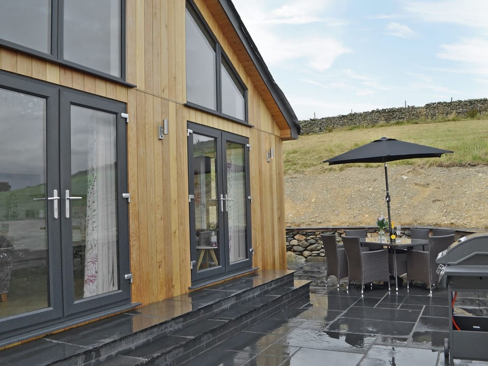 Relaxing patio with garden furniture | Sprint Lodge, Burneside, near Kendal