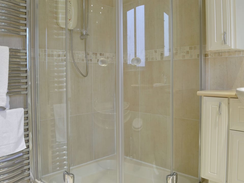 Bathroom with spa bath and shower cubicle | Hawthorn Cottage, Stranraer