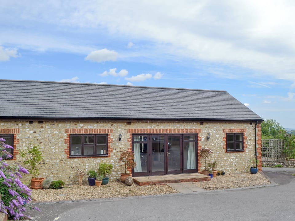 Double bedroom with zip and link super kingsize bed (can be twin beds on request) | The Barn - Smiths Farm Cottages, Charmouth, near Lyme Regis