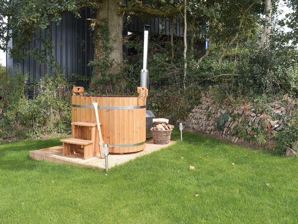 Relax in the sumptuous wood-fired hot tub | The Cart Linhay, Meshaw, near South Molton