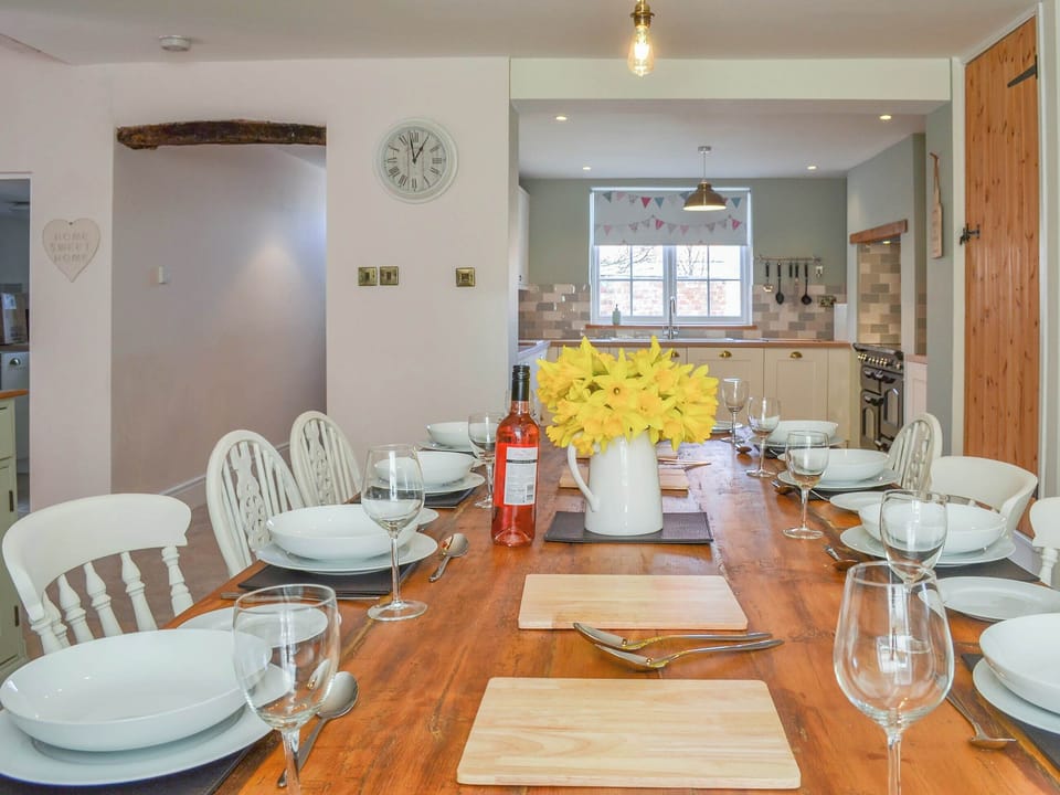 Delightful dining room and adjacent kitchen | West House Farm, Muston, near Filey