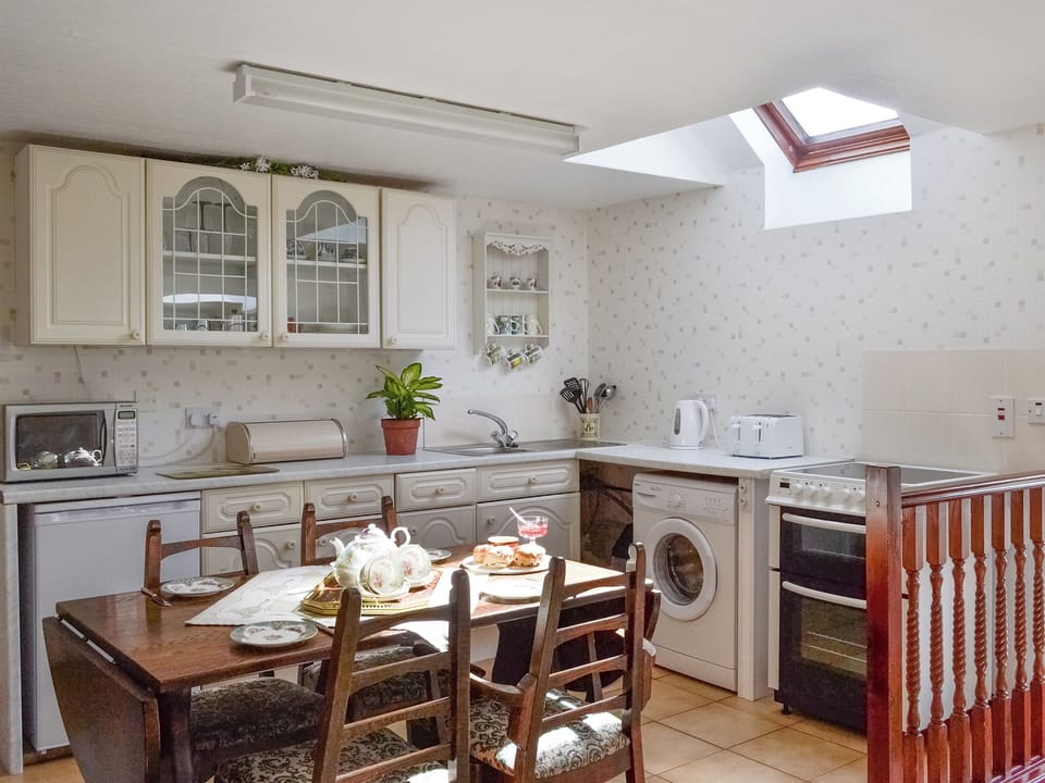 Well-equipped fitted kitchen with dining area | Low Cordorcan - Cordorcan Cottages, Wood of Cree, near Newton Stewart