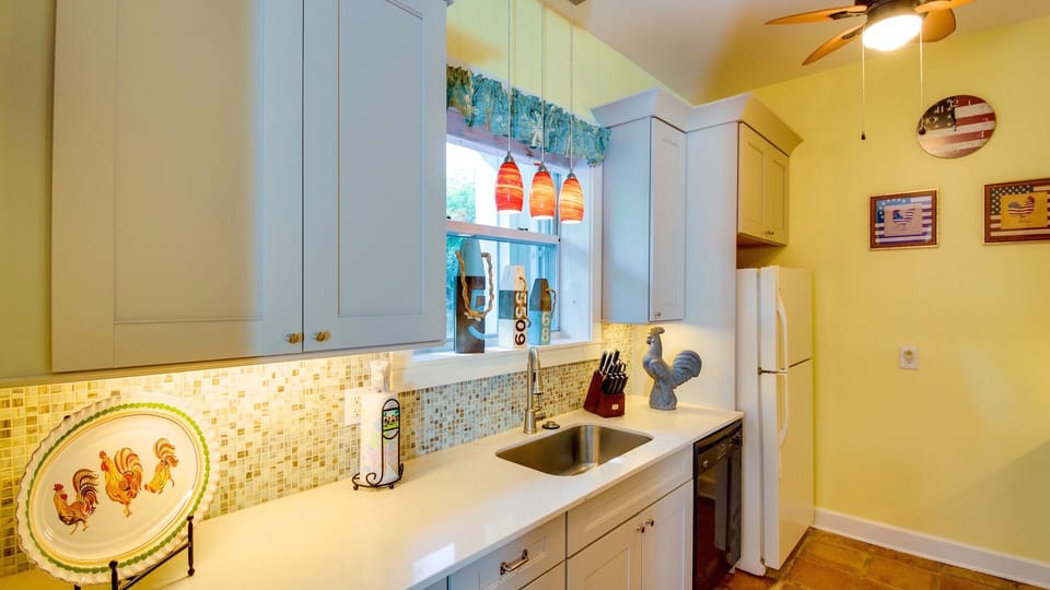 Americana Tropicale - The fully equipped kitchen sits off the living area and has all of the appliances and tools you'll need...