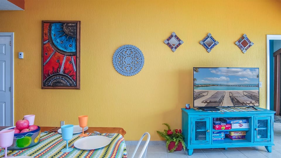 More color in th eleven groom, the TV and entertainment center, and Mexican inspired dining table.