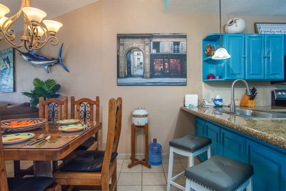 Dining table and seating at the kitchen counter.