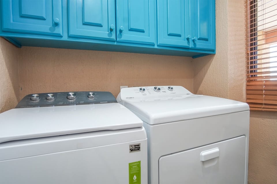 Washer and dryer in separate utility room.