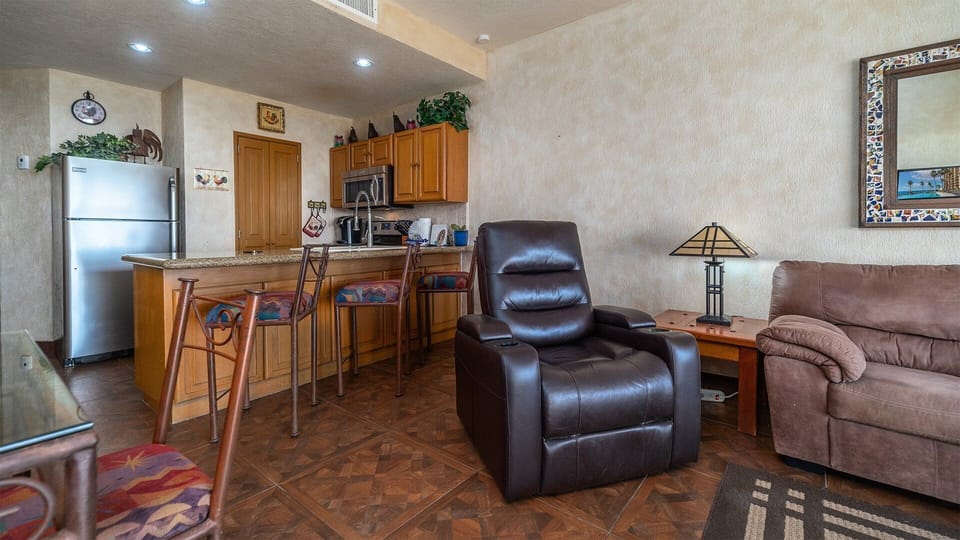 Recliner by the kitchen counter.