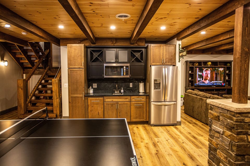 Wet bar in lower level, dishwasher, fridge with ice maker and microwave. 