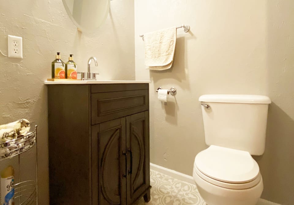 Use the half bathroom to wash your hands before dinner.