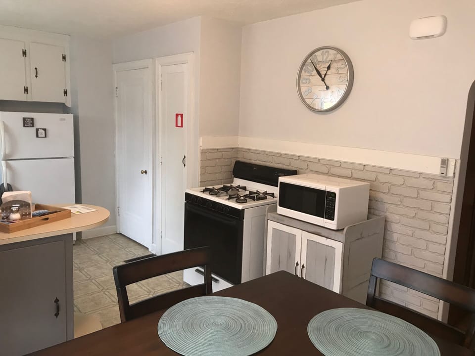 Gas oven/stove and microwave for all your cooking needs.