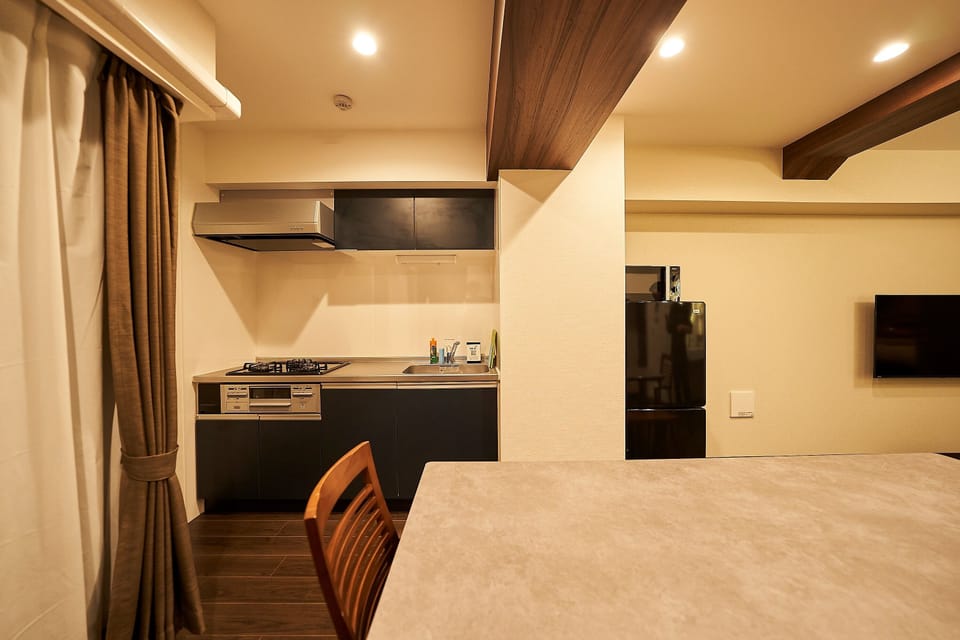 Family Condo, Non Smoking | Private kitchen | Full-size fridge, microwave, stovetop, electric kettle