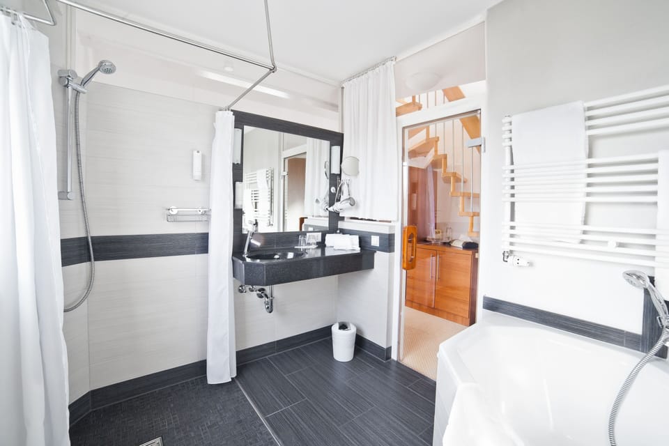 Luxury Studio Suite, City View | Bathroom amenities | Deep soaking tub, hydromassage showerhead, free toiletries, hair dryer
