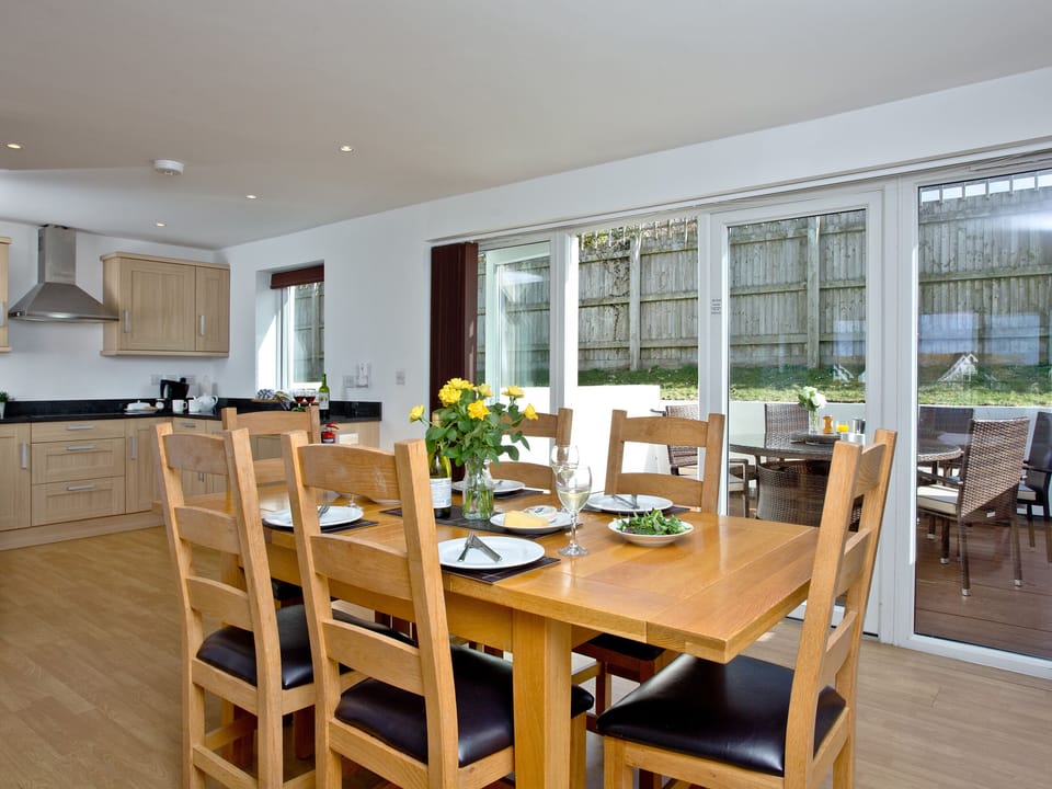 Dining area and adjacent kitchen | Sea Glimpses - Glendorgal, Newquay