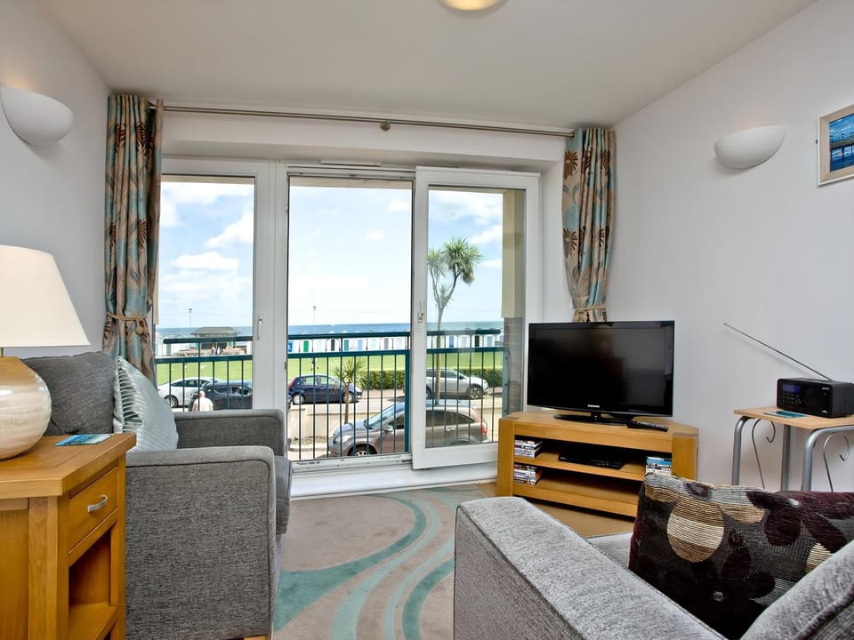 Relaxing living area with sea views | 16 Belvedere Court, Paignton