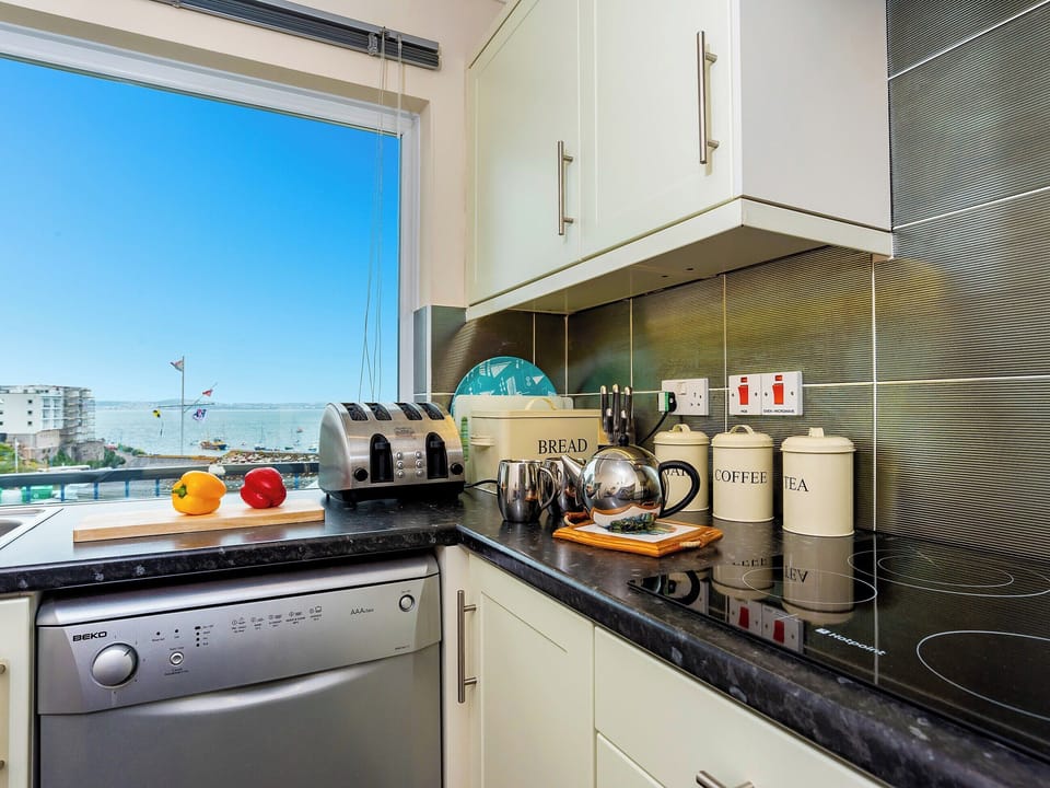 Well appointed kitchen with spectacular views | 9 Dolphin Court, Brixham