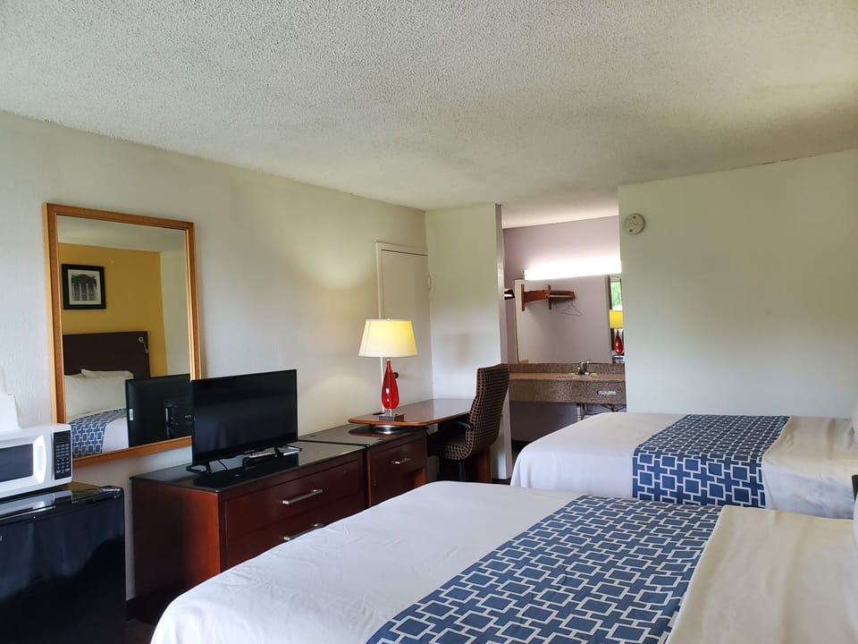Standard Room, 2 Queen Beds, Non-Smoking | Desk, iron/ironing board, free WiFi, bed sheets