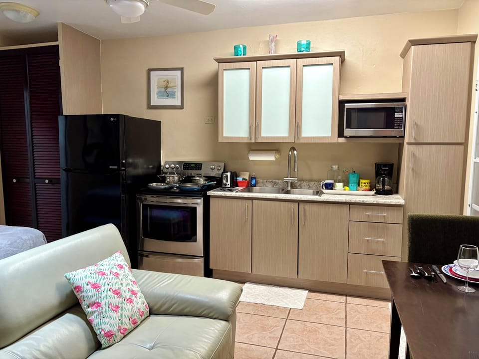 Full kitchen full size refrigerator, stove, double sinks.