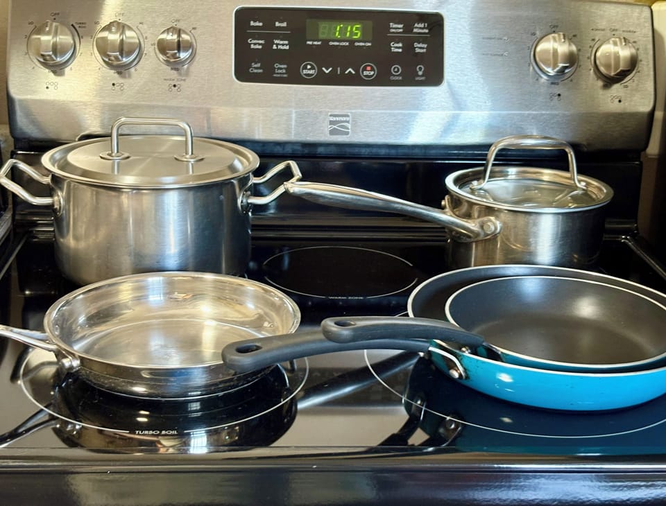 Full size stove and oven with stainless steel pots and pans