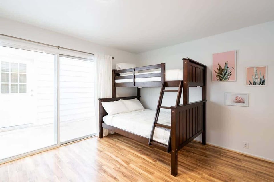 Four bunk beds in bedroom four with two doubles and two twin size beds.