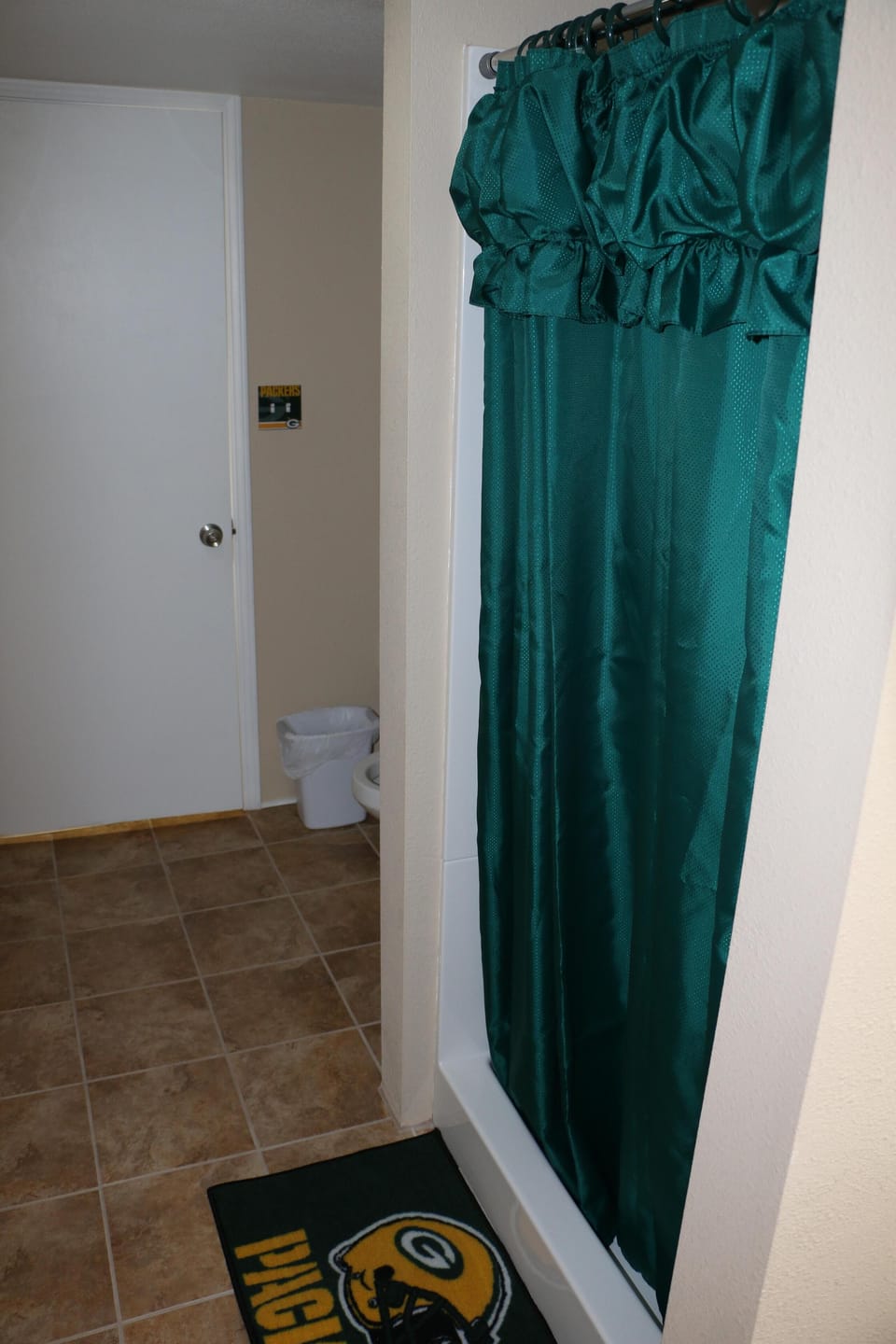 Bathroom #2 toilet, shower, sink and tiled floor