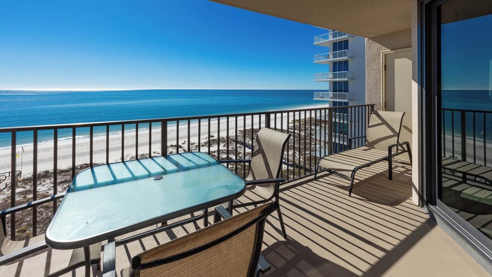 Savor your morning coffee at the table on your balcony while taking in breathtaking coastal views and sunshine