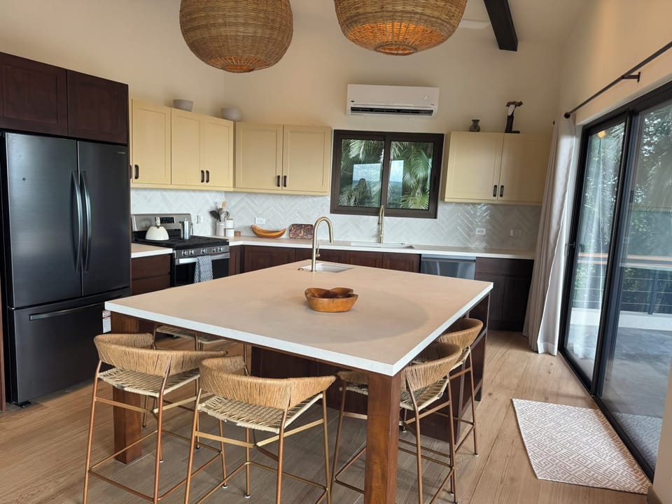 Enter from the patio into the kitchen/living space 