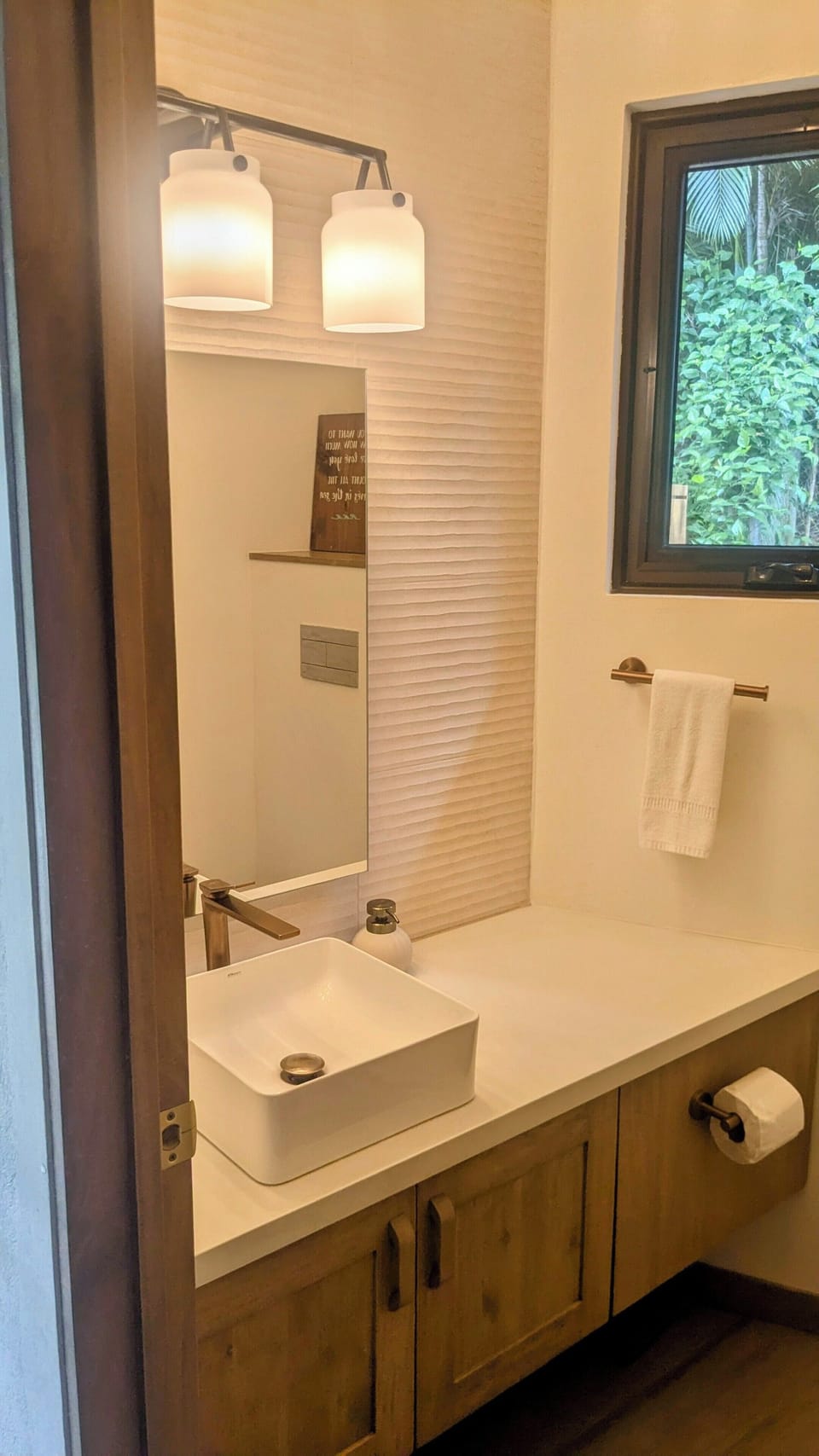 A powder-room is conveniently located next to the front door