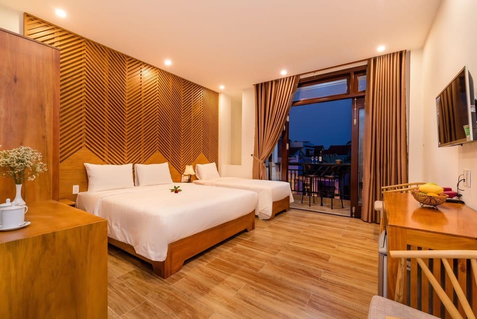 Deluxe Triple Room, Balcony, City View | 1 bedroom, minibar, desk, laptop workspace
