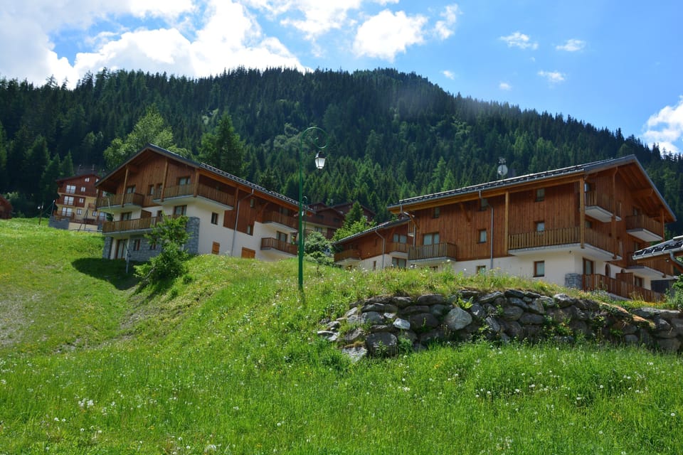 Breathe in the fresh mountain air while surrounded by charming chalets nestled in lush meadows.