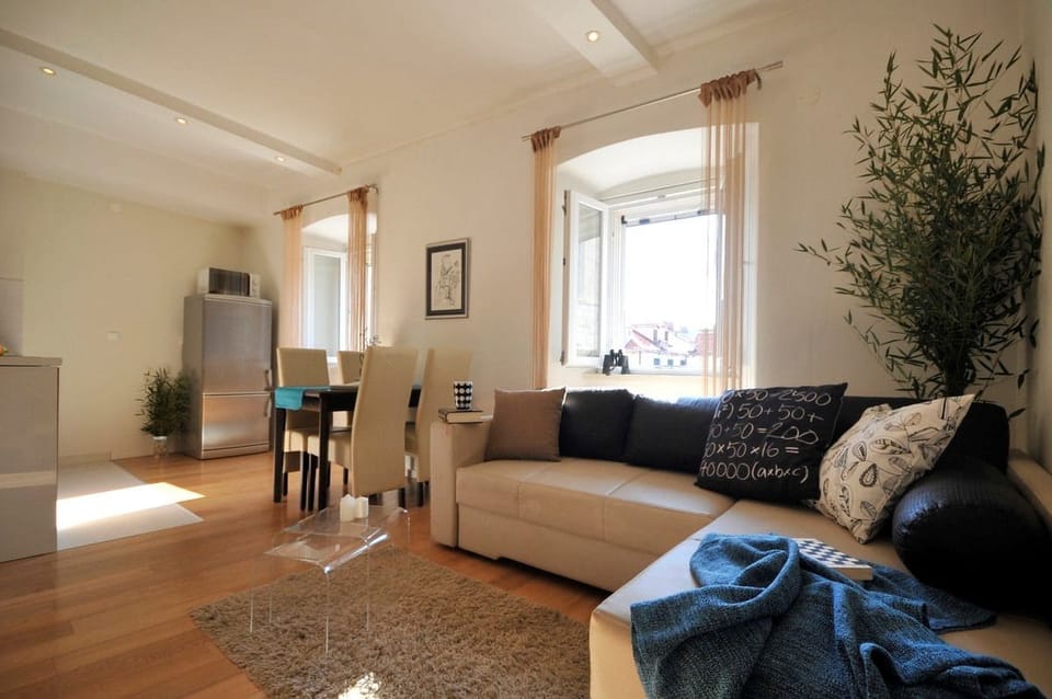 Apartment, 4 Bedrooms | Living area | Flat-screen TV
