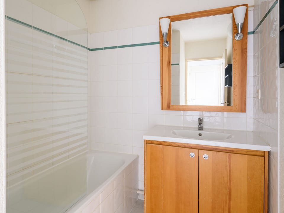 The stylish bathroom combines functionality and aesthetics with its clean lines and contemporary fixtures.